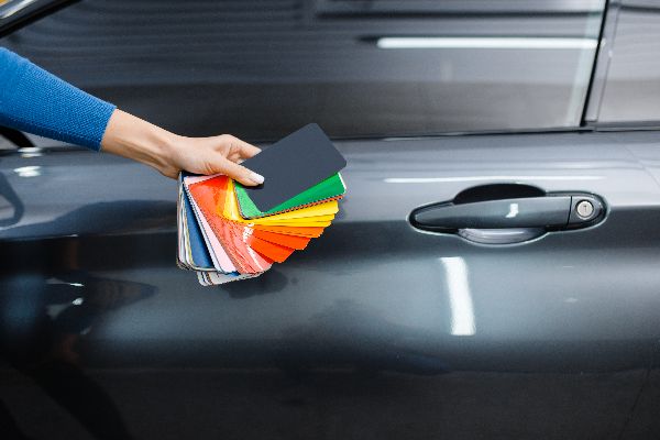 car-wrapping-male-hand-with-protective-vinyl-foil-film-color-palette-worker-makes-auto-detailing-automobile-paint-protection-coating-professional-tuning